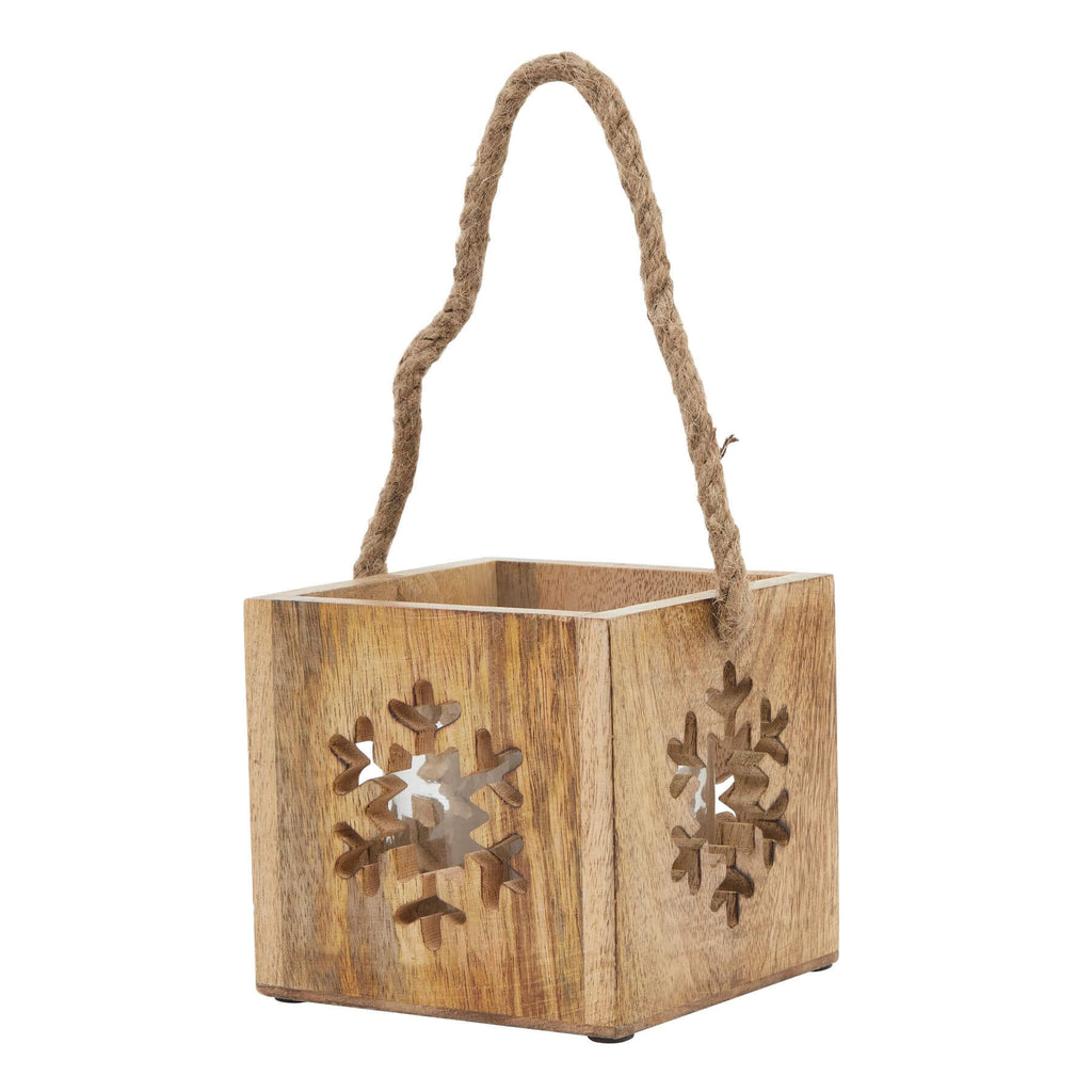 Handcrafted wooden snowflake tealight holder with glass insert, warm brown rustic decor for holiday ambiance. by RoomLondon at brixbailey.com
