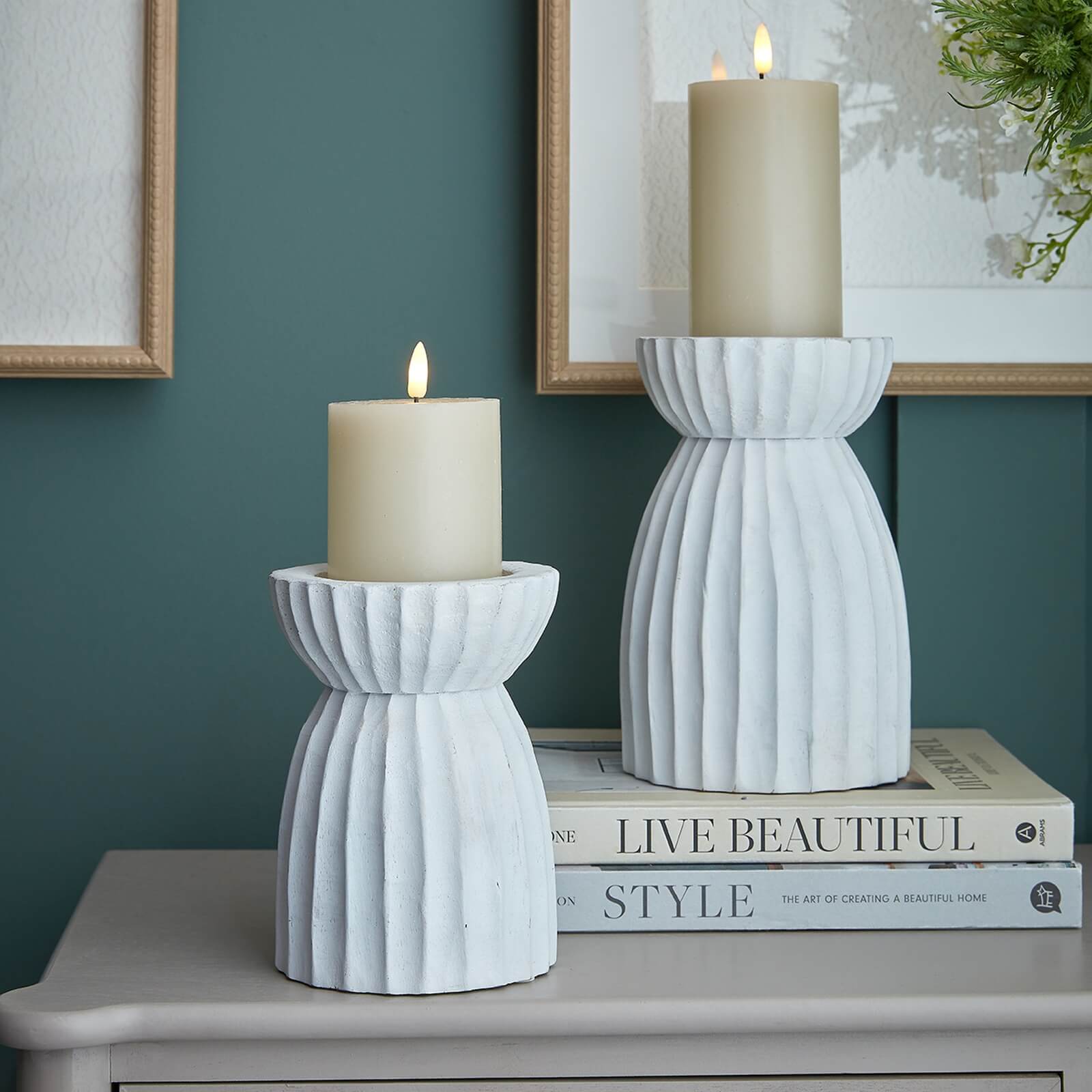 White carved glass hurricane lantern with intricate geometric patterns, warm atmospheric glow, traditional design. by RoomLondon at brixbailey.com