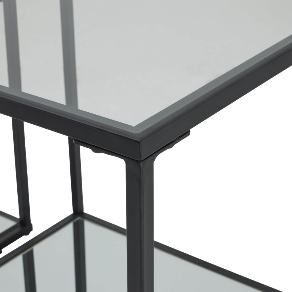 Sleek black Lennox side tables with metal frame and glass top, modern minimalist design for contemporary living spaces by Sostter at brixbailey.com