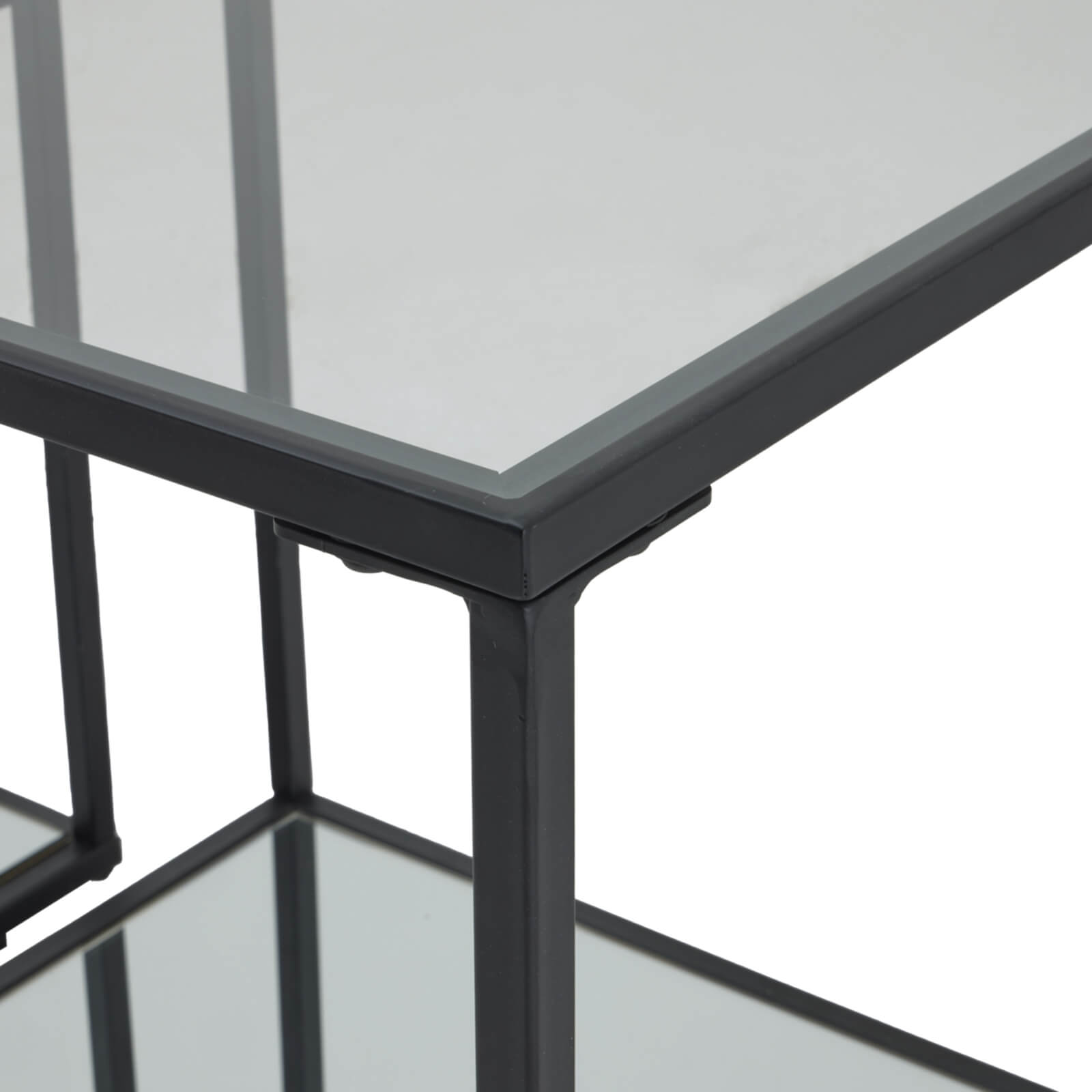 Sleek black Lennox side tables with metal frame and glass top, modern minimalist design for contemporary living spaces by Sostter at brixbailey.com