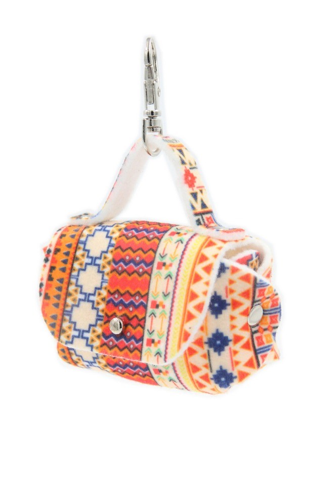 close-up of boho dog bag dispenser attached to a leash showing the metal eyelet and snap hook