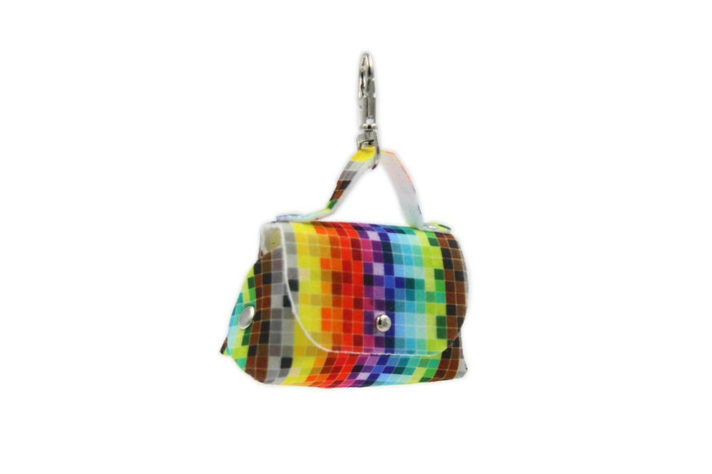 bold pixel-pattern dog bag dispenser attached to a leash in dramatic light