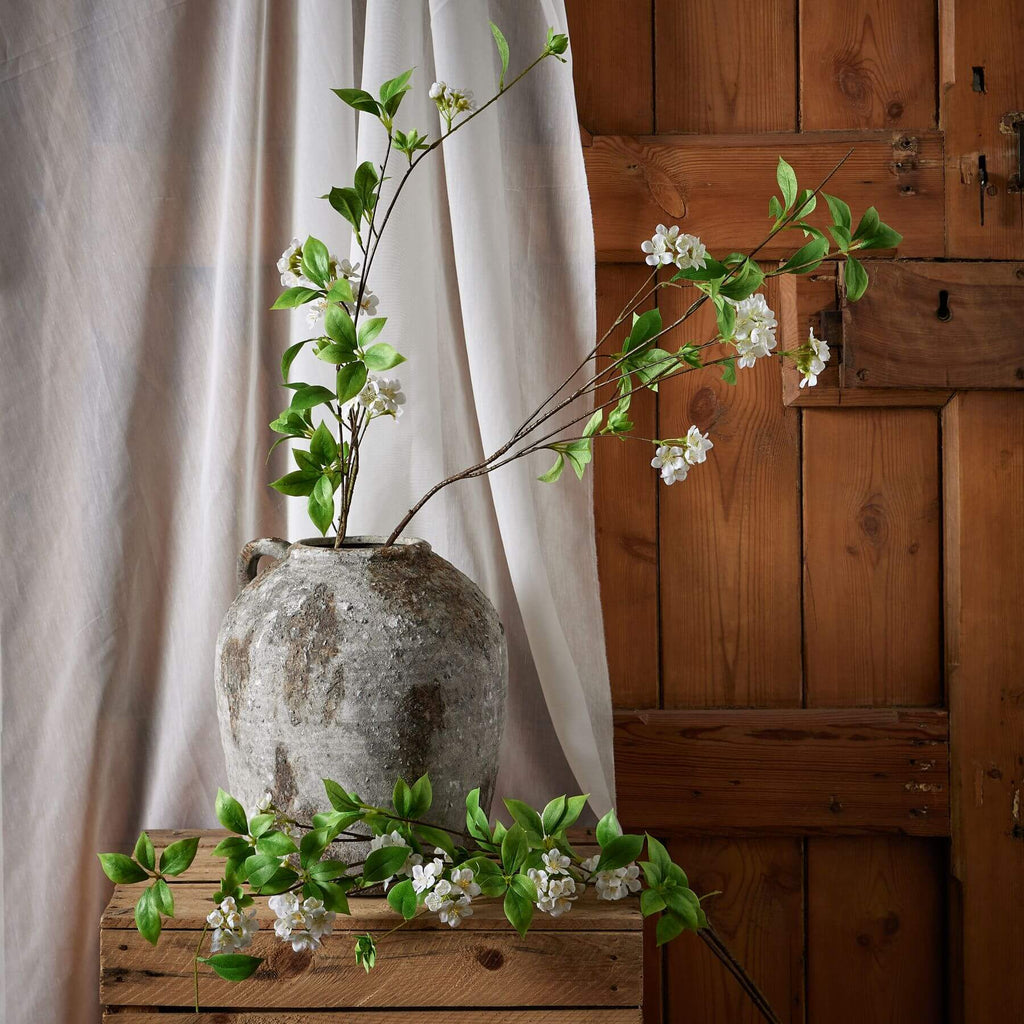 Mock orange spray with glossy green leaves and delicate white petals, 53-inch artificial floral decor by Sostter at brixbailey.com