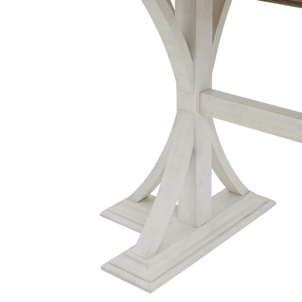 Handcrafted pine bar table with rich wood grain and white base, rustic-modern style for dining or entertaining. by RoomLondon at brixbailey.com