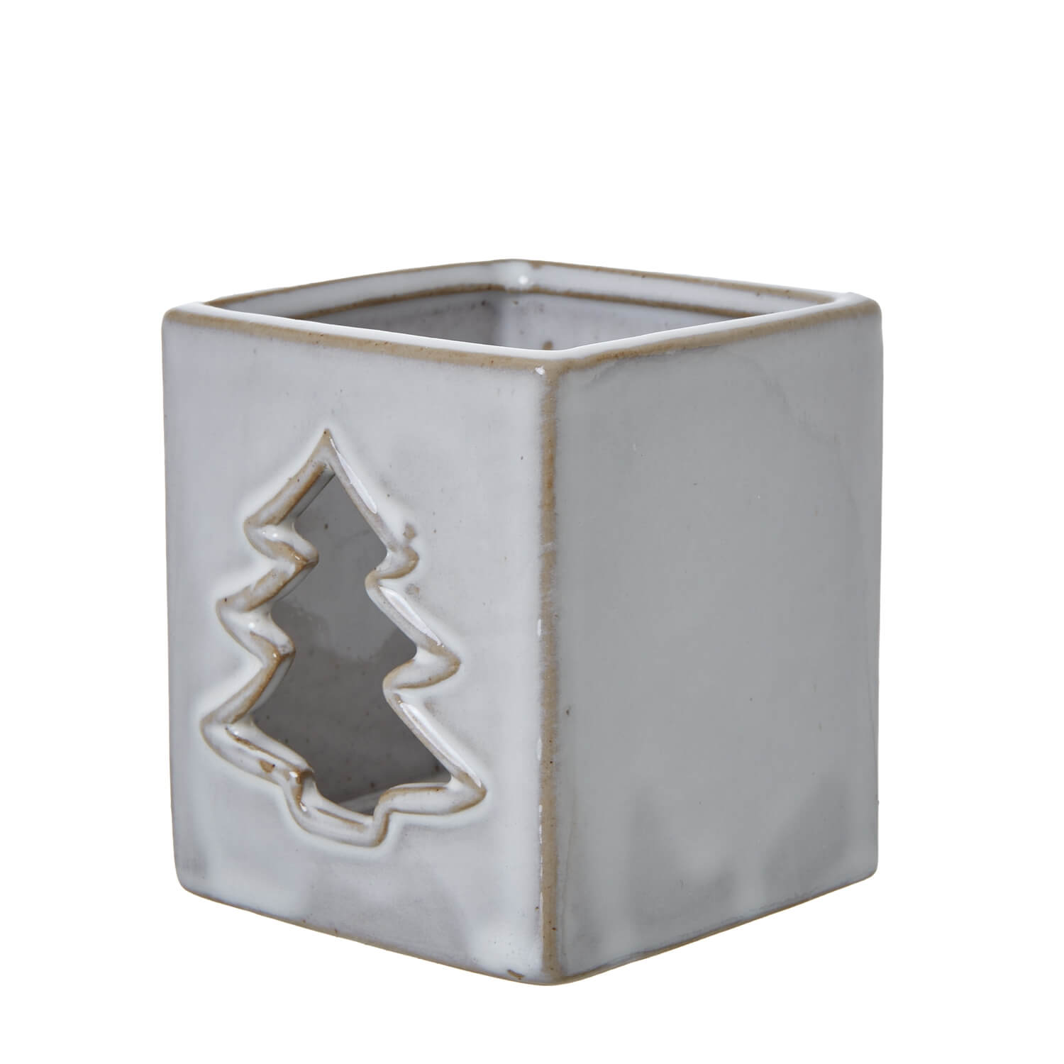 White ceramic tealight holder with intricate tree cut-outs casting shadow patterns, minimalist home decor by sostter at brixbailey.com
