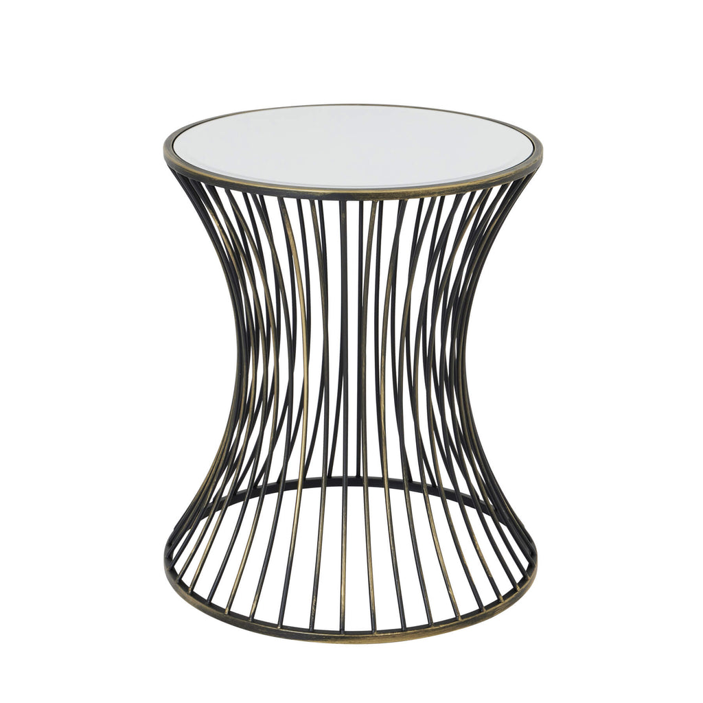 Handcrafted brass side table with black patina finish, concave silhouette, and mirrored glass surface for modern interiors. by RoomLondon at brixbailey.com