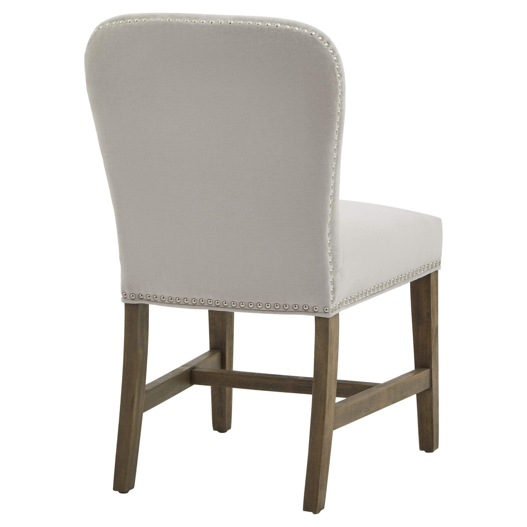 Cobham grey dining chair with padded seat, weathered oak frame, and antique brass studs in French provincial style by Sostter at brixbailey.com