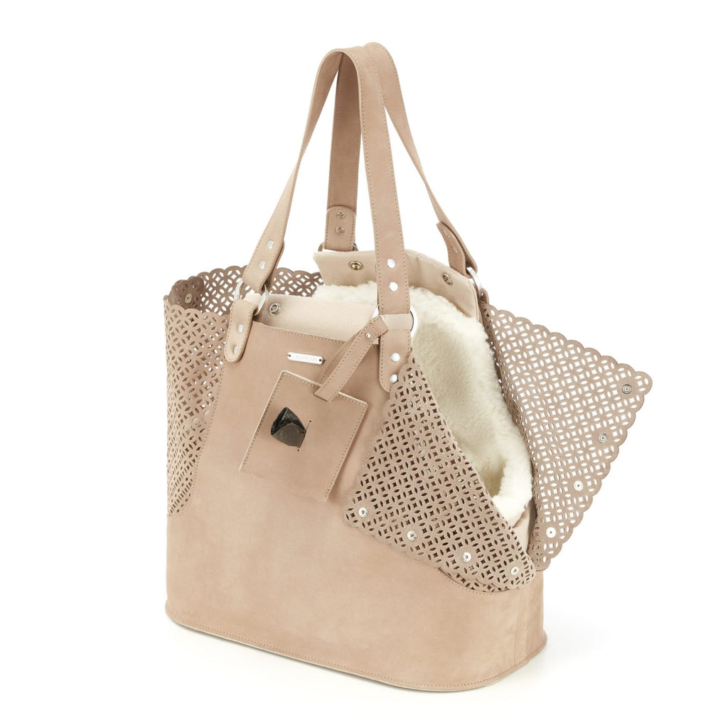 elegant nude nubuck leather dog carrier with a refined cotton insert on a marble surface