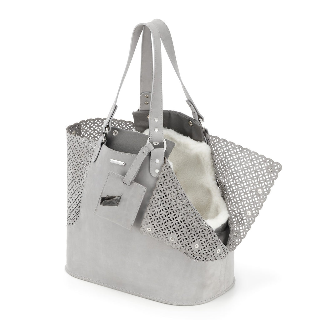 soft grey nubuck dog carrier with cozy sheep wool insert in warm morning light