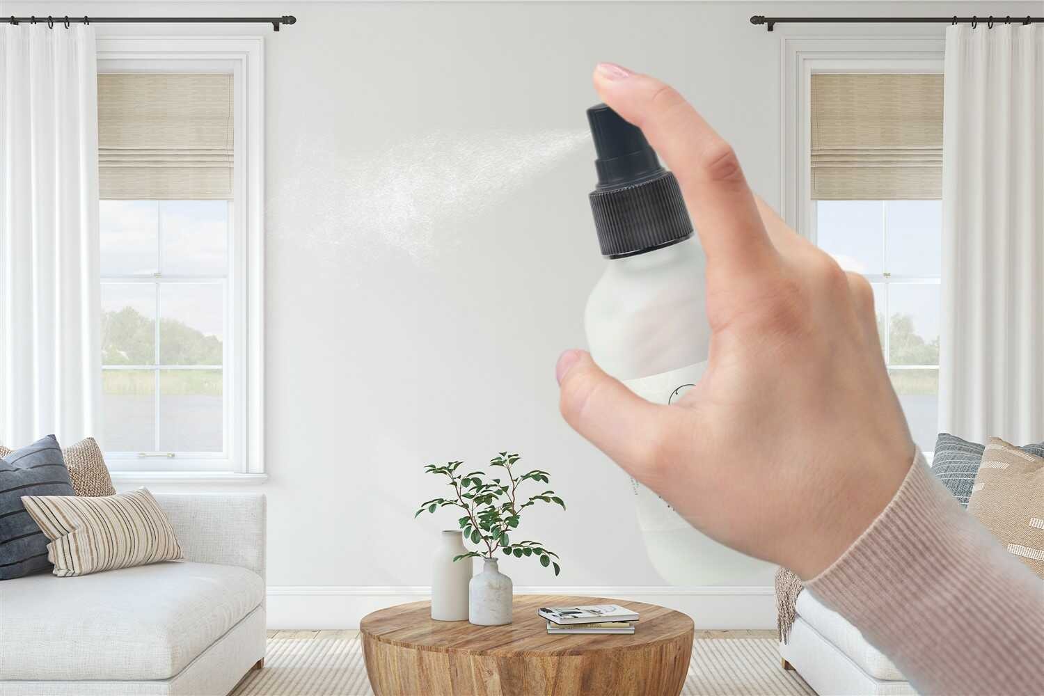 eucalyptus room spray bottle on a bathroom counter with natural morning light