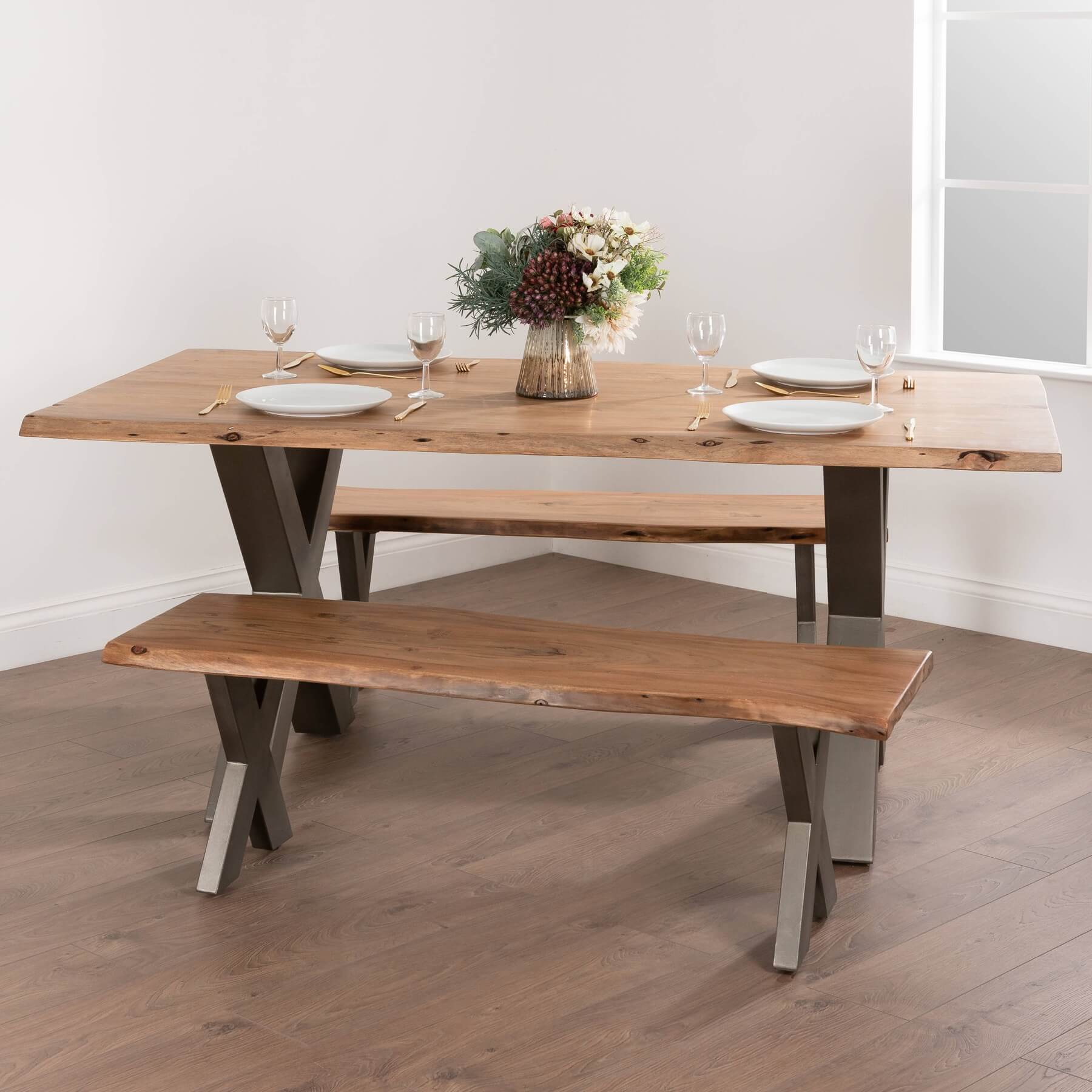 Handcrafted acacia wood live edge dining table with grey metal legs, showcasing natural wood grain and rustic-modern design. by sostter at brixbailey.com