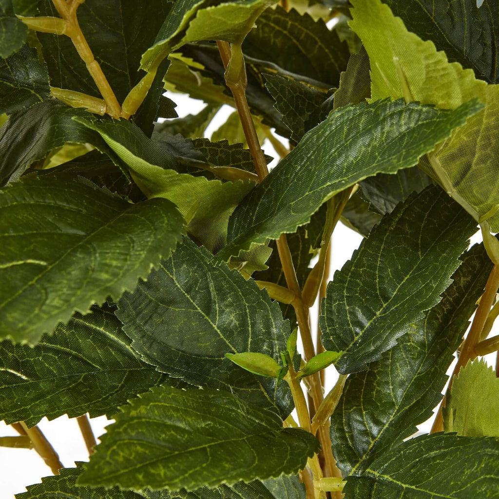 Lifelike faux green hydrangea plant with white blooms, lush foliage, and natural elegance for home decor by Sostter at brixbailey.com