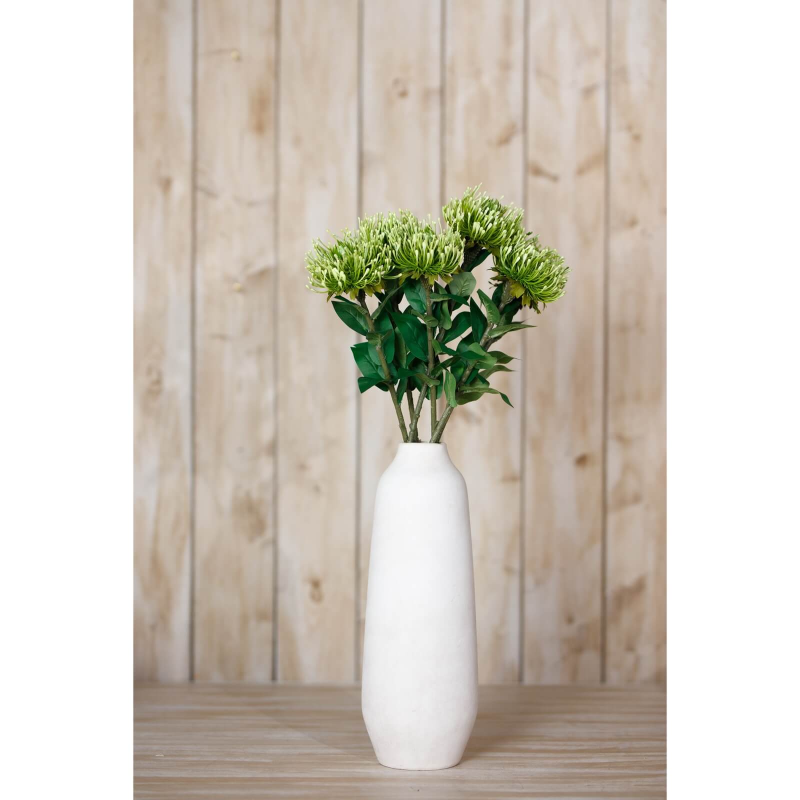 Lush green faux Protea Lorea stem with hyper-realistic pom-pom blooms, 73cm tall for elegant floral arrangements by sostter at brixbailey.com