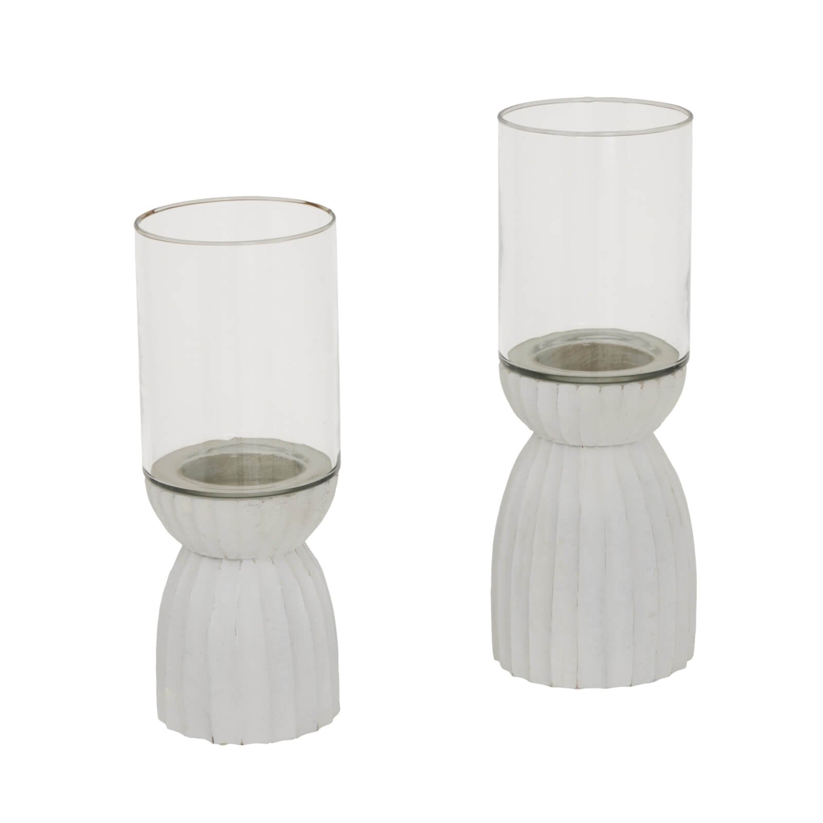 White carved hurricane lantern with intricate geometric patterns, durable glass, warm atmospheric glow by RoomLondon at brixbailey.com