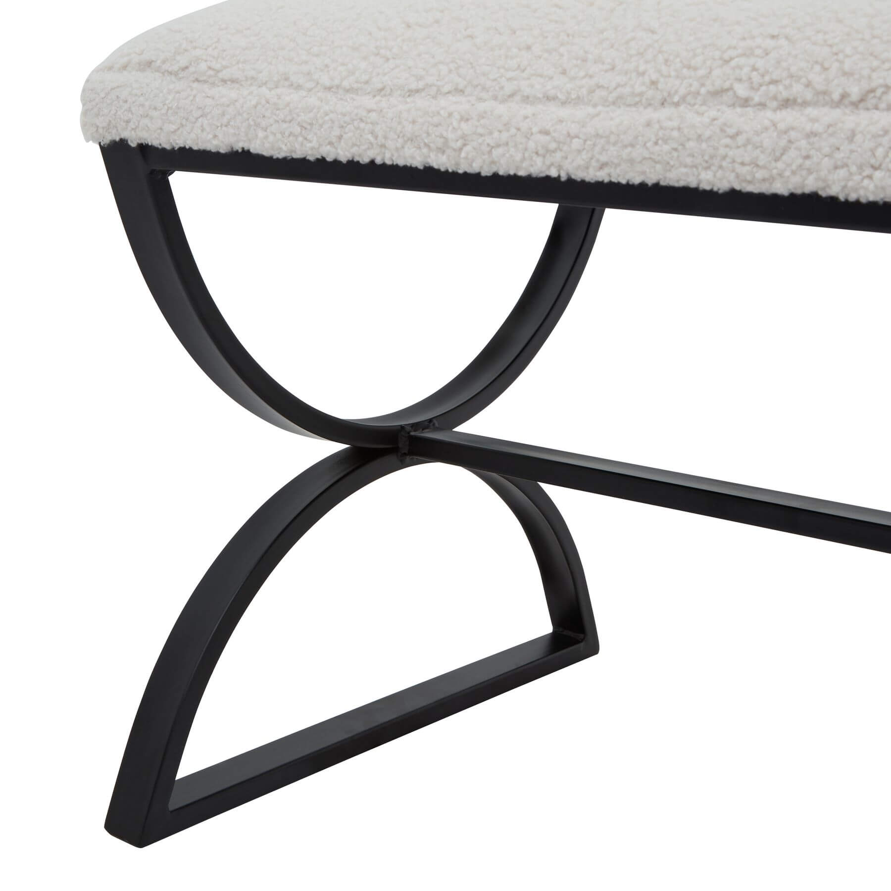 Cream boucle ribbed footstool with black metal curved legs, plush textured upholstery, and modern design by sostter at brixbailey.com