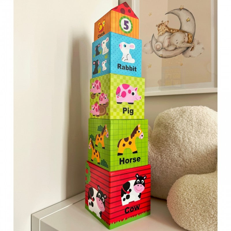 functional view of all 5 farm puzzle cubes and wooden animals neatly arranged by size