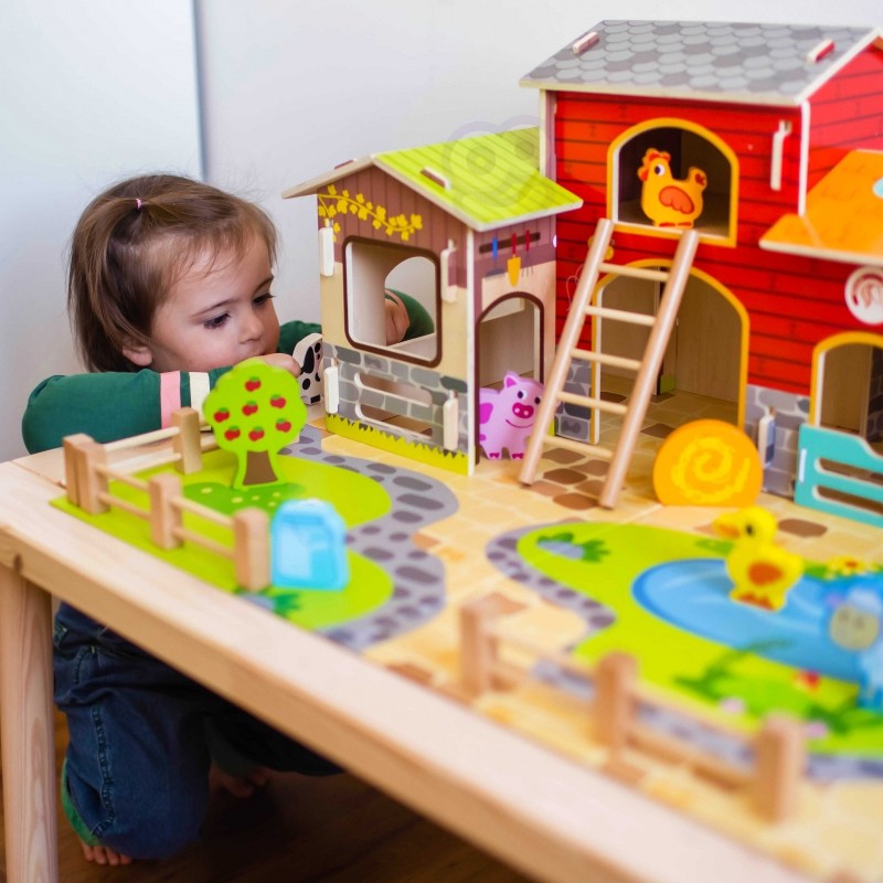 a playful pig and sheep in the woopie green mega farm set's wooden stable
