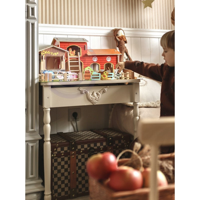 a playful pig and sheep figurine from the woopie green mega farm set on a wooden table