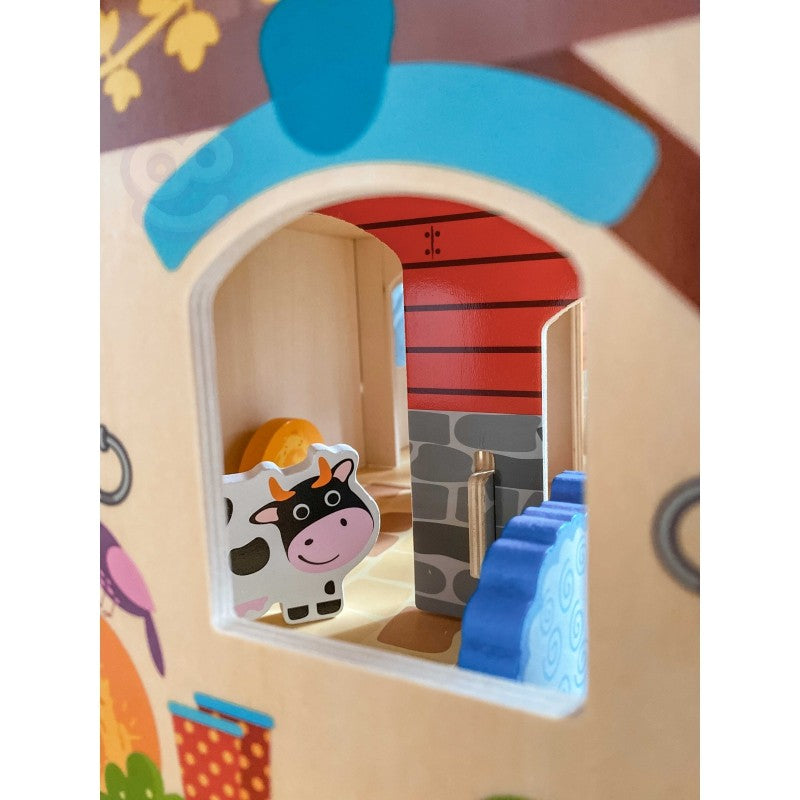 a playful overhead shot of the woopie green farm set with all 18 wooden pieces scattered