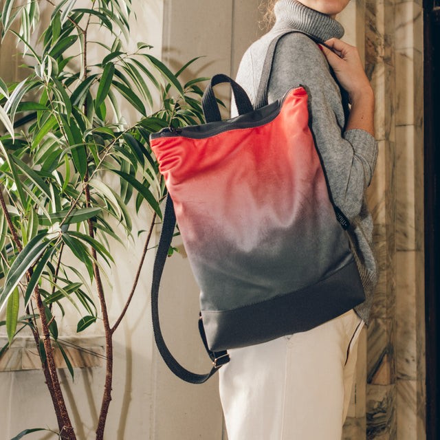 soft salmon faux leather backpack with a cozy velvet front and grey waterproof bottom