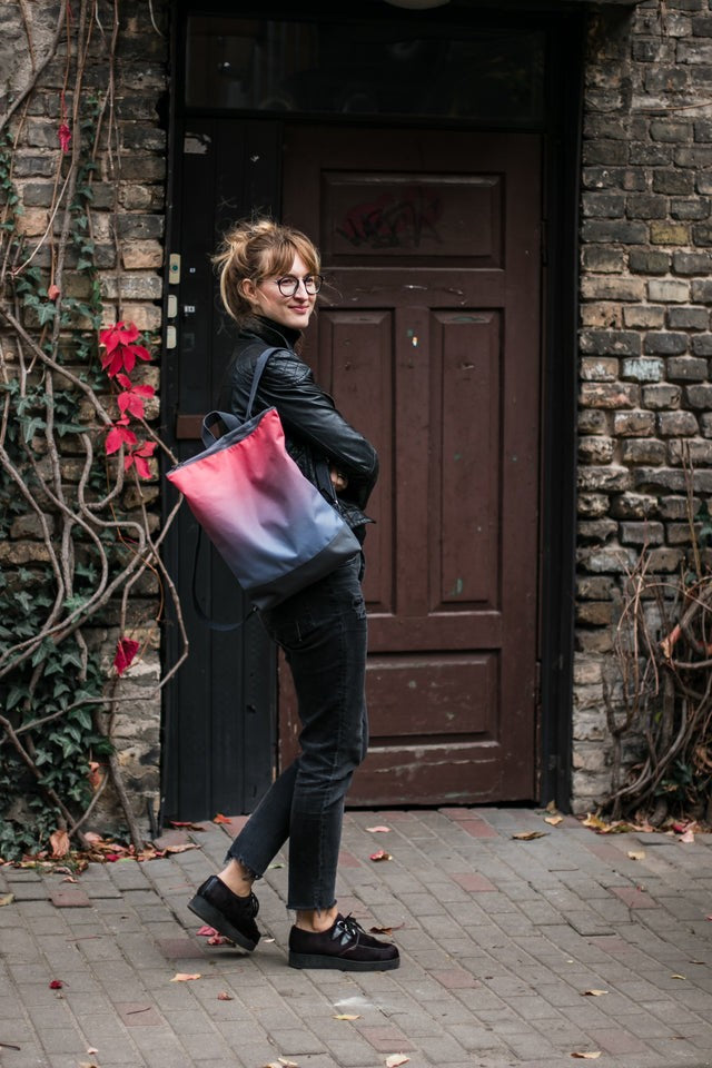 handmade salmon faux leather backpack with a velvet muni design on a soft grey background