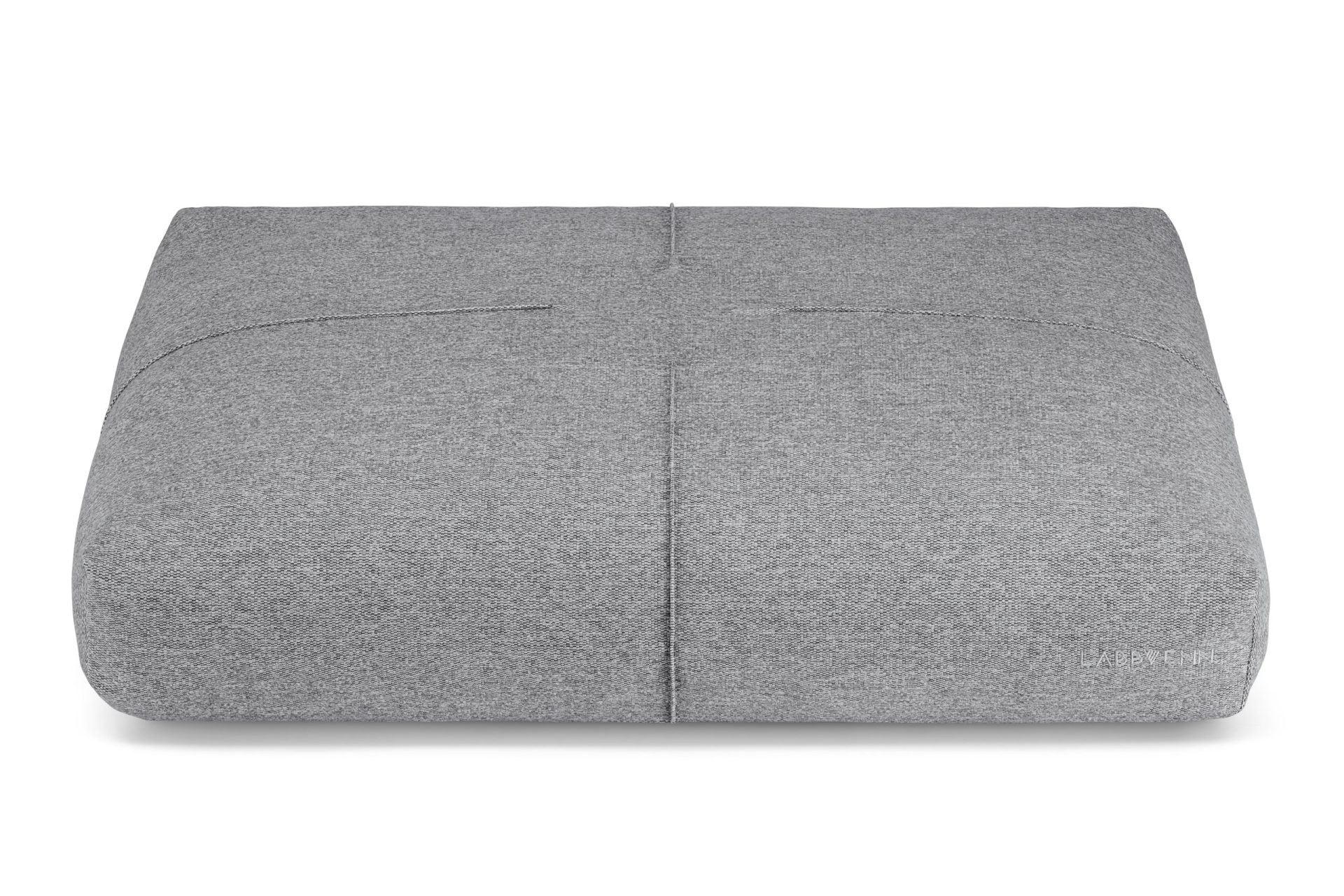 a serene anthracite grey dog cushion with soft decorative stitching in warm, inviting light