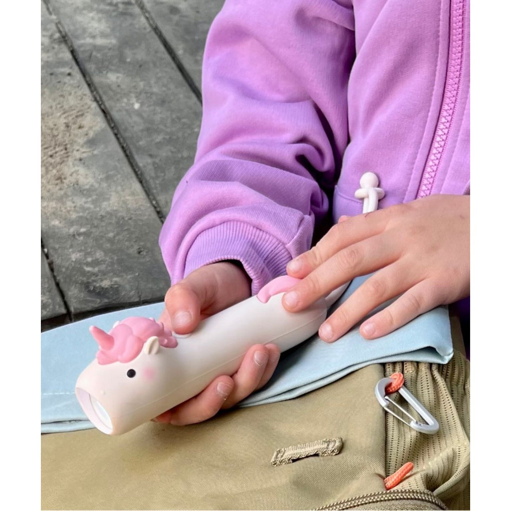 elegant pink unicorn flashlight for kids with soft silicone body and hanging loop