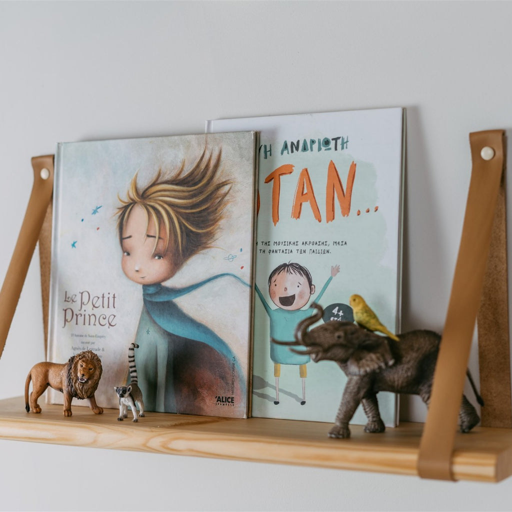 close-up of a 60 cm solid pine floating shelf showing its leather strap mounting hardware