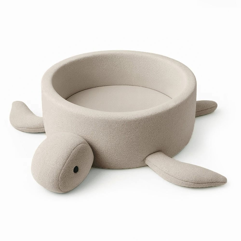 soft oat beige turtle ball pit with cozy boucle texture in a calm nursery setting