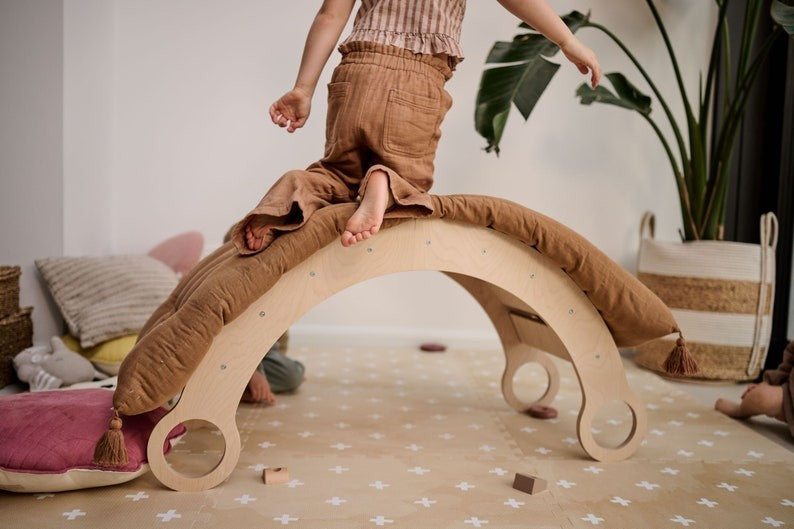 a soft cross sand foam playmat in gentle light, perfect for a baby's cozy tummy time