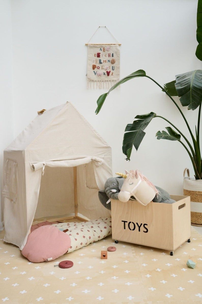close-up of a neutral cross sand foam playmat tile showing its 1.2 cm thickness and interlocking edge