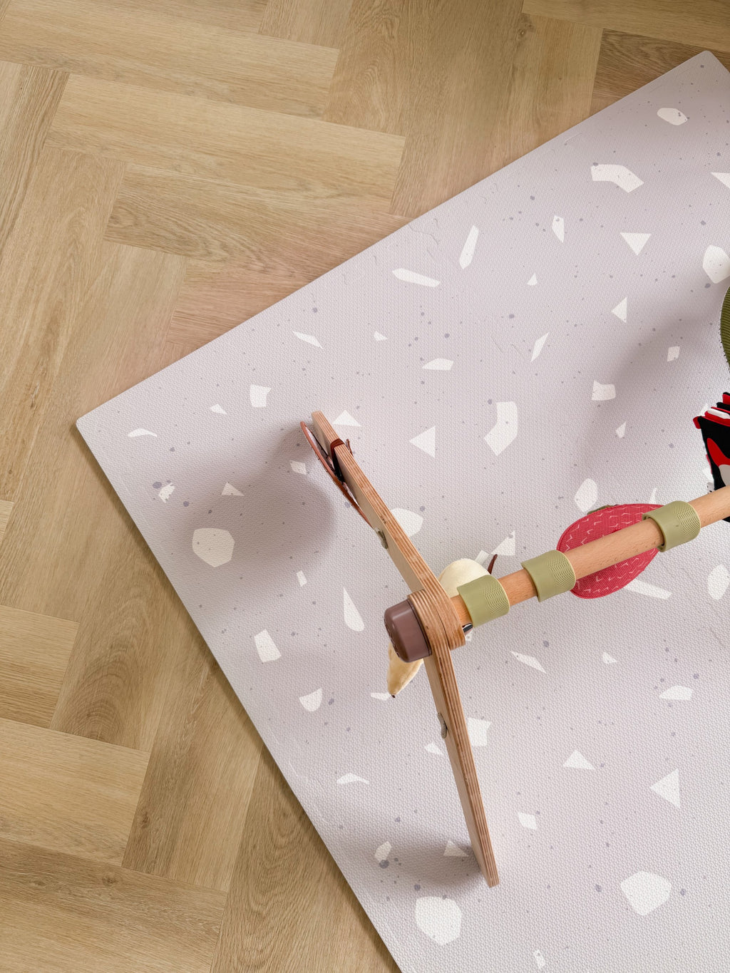 elegant lavender terrazzo foam playmat for babies on a polished wood floor