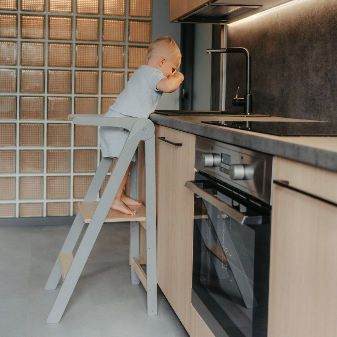 foldable birch helper tower in a bright kitchen with morning light