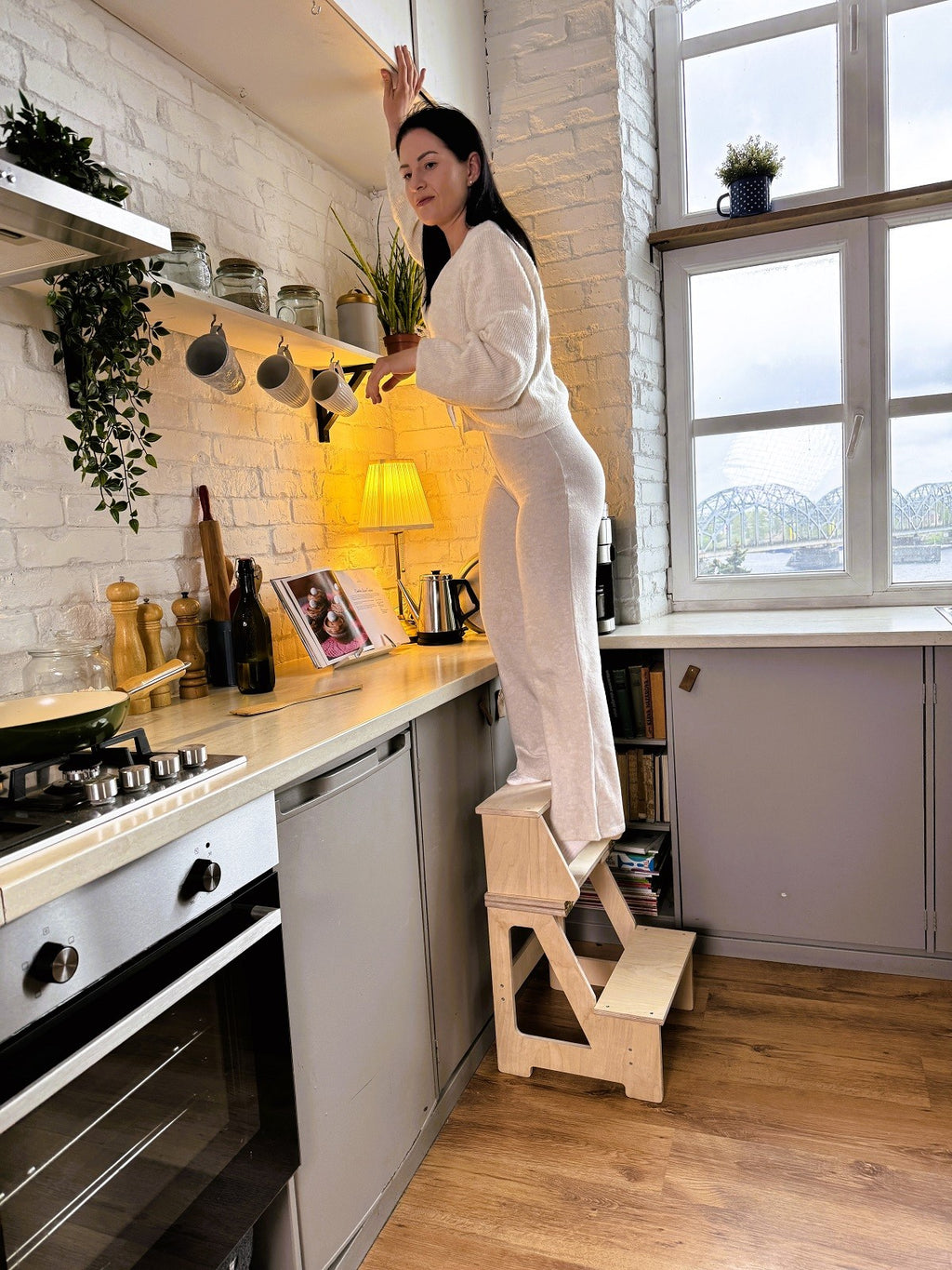bold solid wood folding seat-step stool in a modern home setting