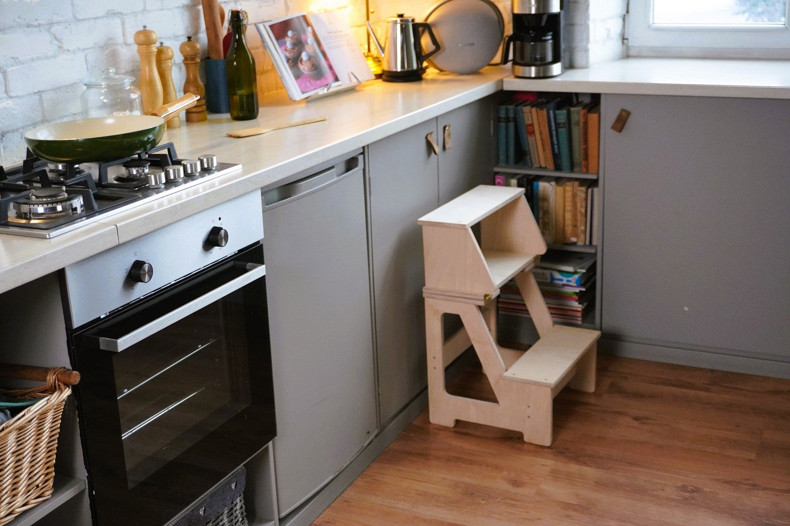 versatile folding wooden step stool in a bright nursery setting