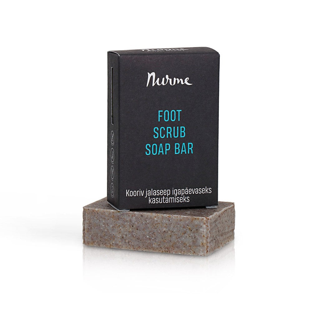 a playful close-up of the foot scrub soap bar with visible pumice and almond shell exfoliants