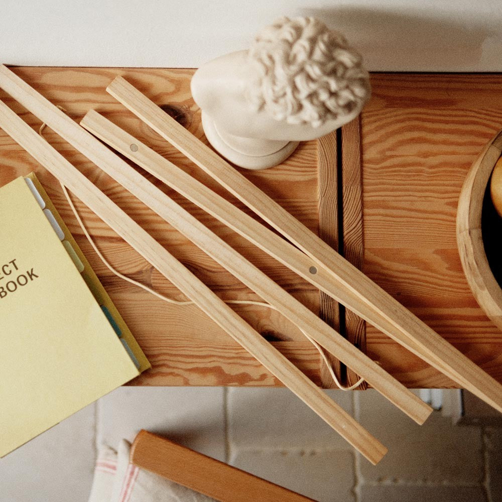 bold 50x70 cm pine frame poster with magnetic closure in dramatic studio lighting