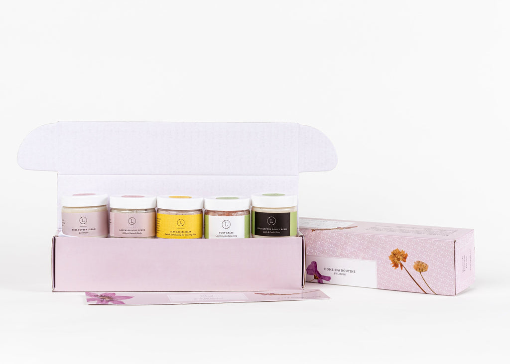 softly lit luxury home spa gift set with natural shea butter cream and foot salt