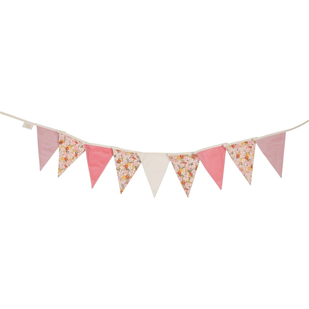 elegant cotton and velvet birthday garland draped gracefully over a canopy bed