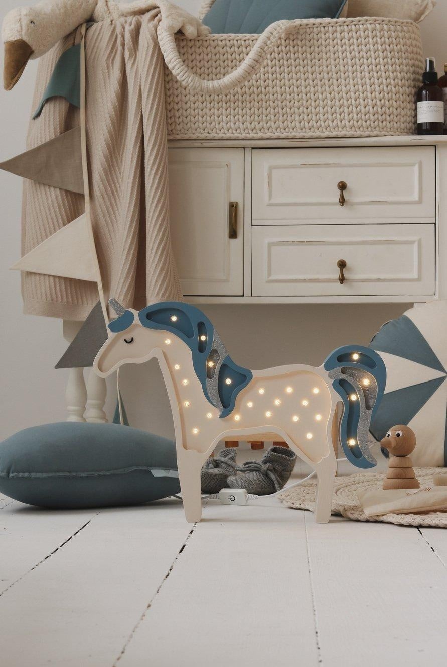 softly draped linen garland in a cozy nursery, with gentle teal and grey pennants casting a serene, comforting glow