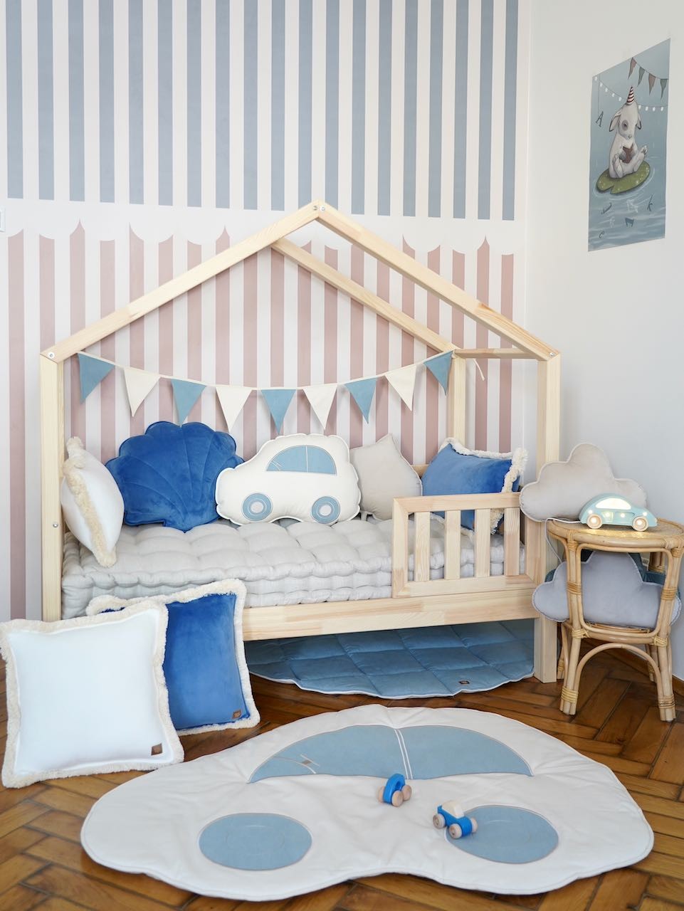 soft cotton and linen jeans garland draped over a wooden crib in warm sunlight, perfect for a cozy nursery