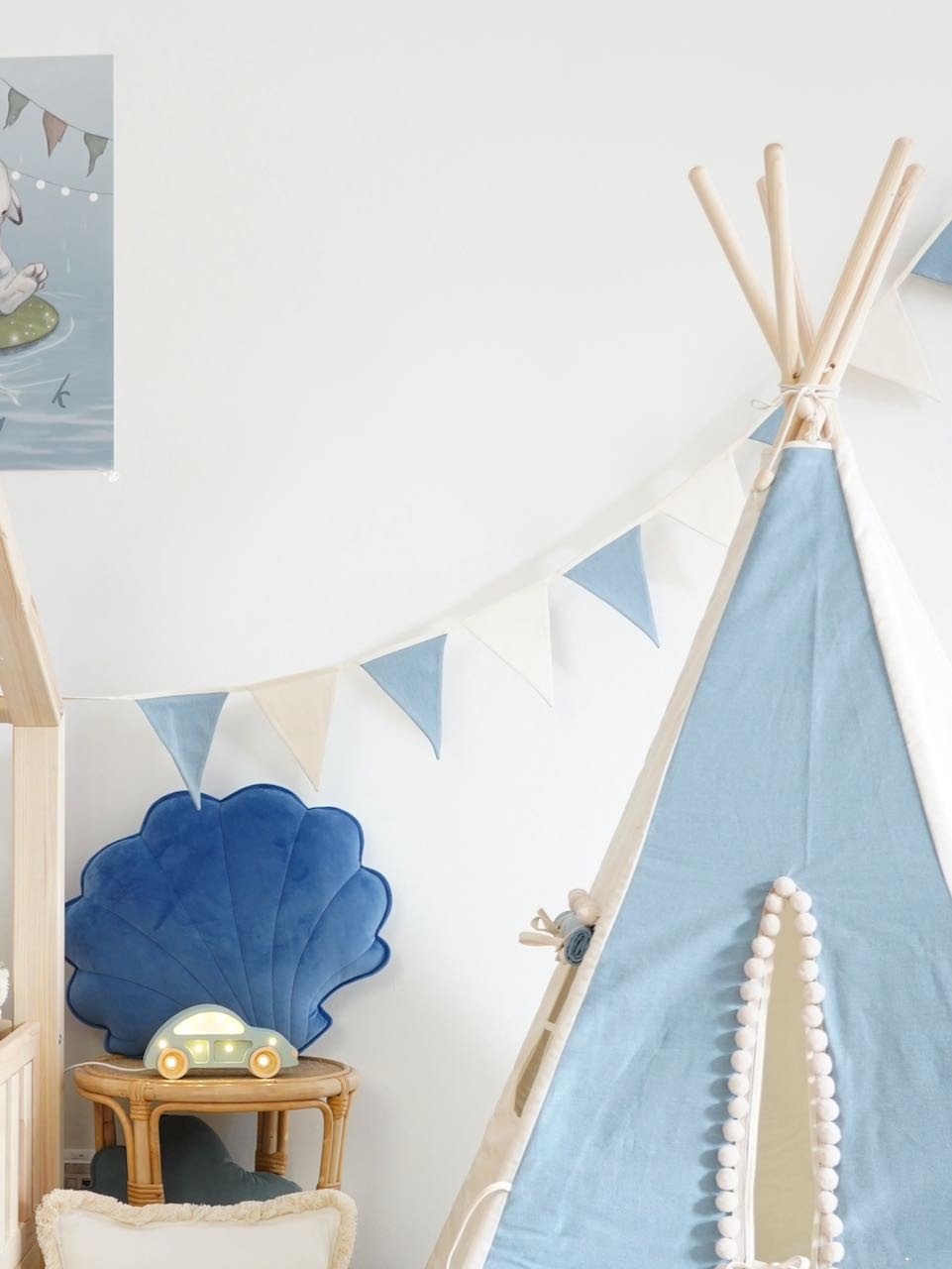 playful cotton and linen jeans garland with 9 pendants, hanging over a cozy nursery crib in soft sunlight