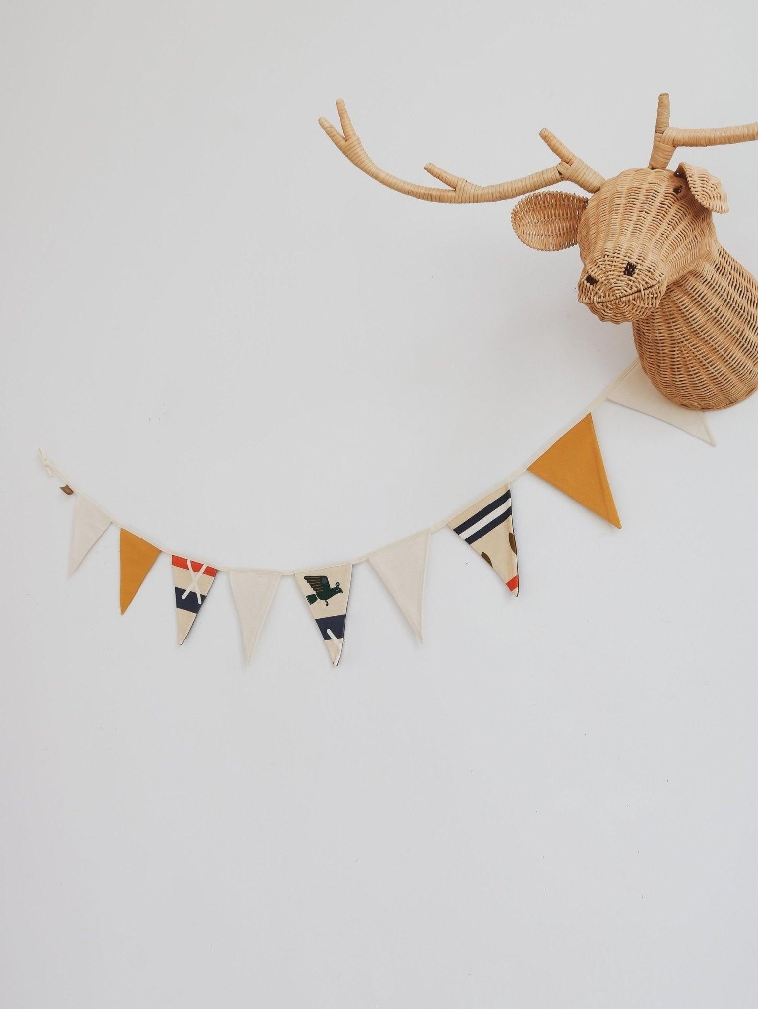 elegant close-up of native vibe cotton garland with warm geometric shapes