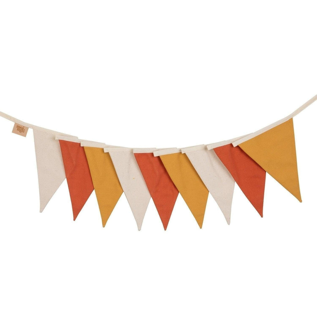 bold ochre floral garland with nine cotton pennants casting dramatic autumn shadows