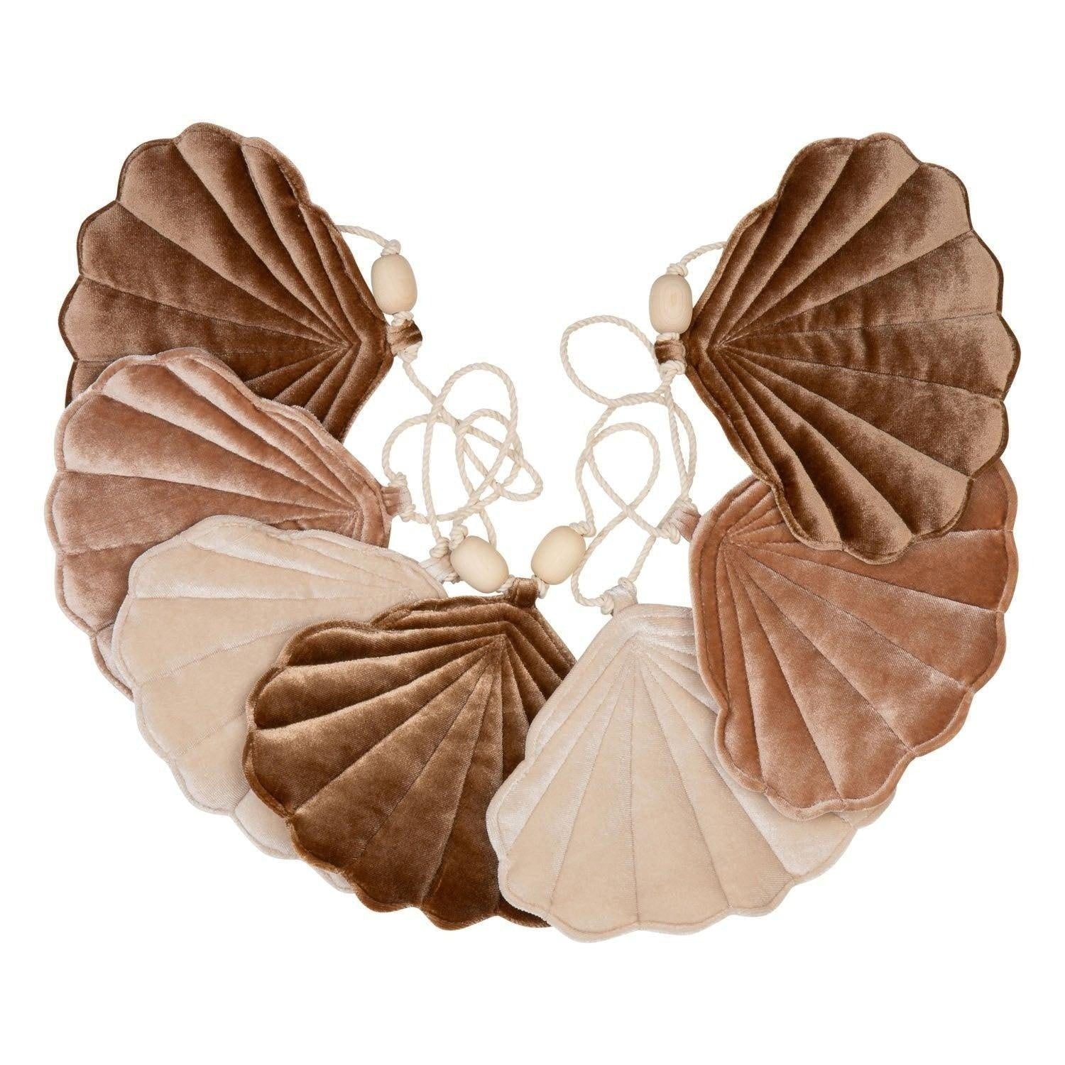 elegant beige pearl shell garland with linen and velvet shells on a dark wood table