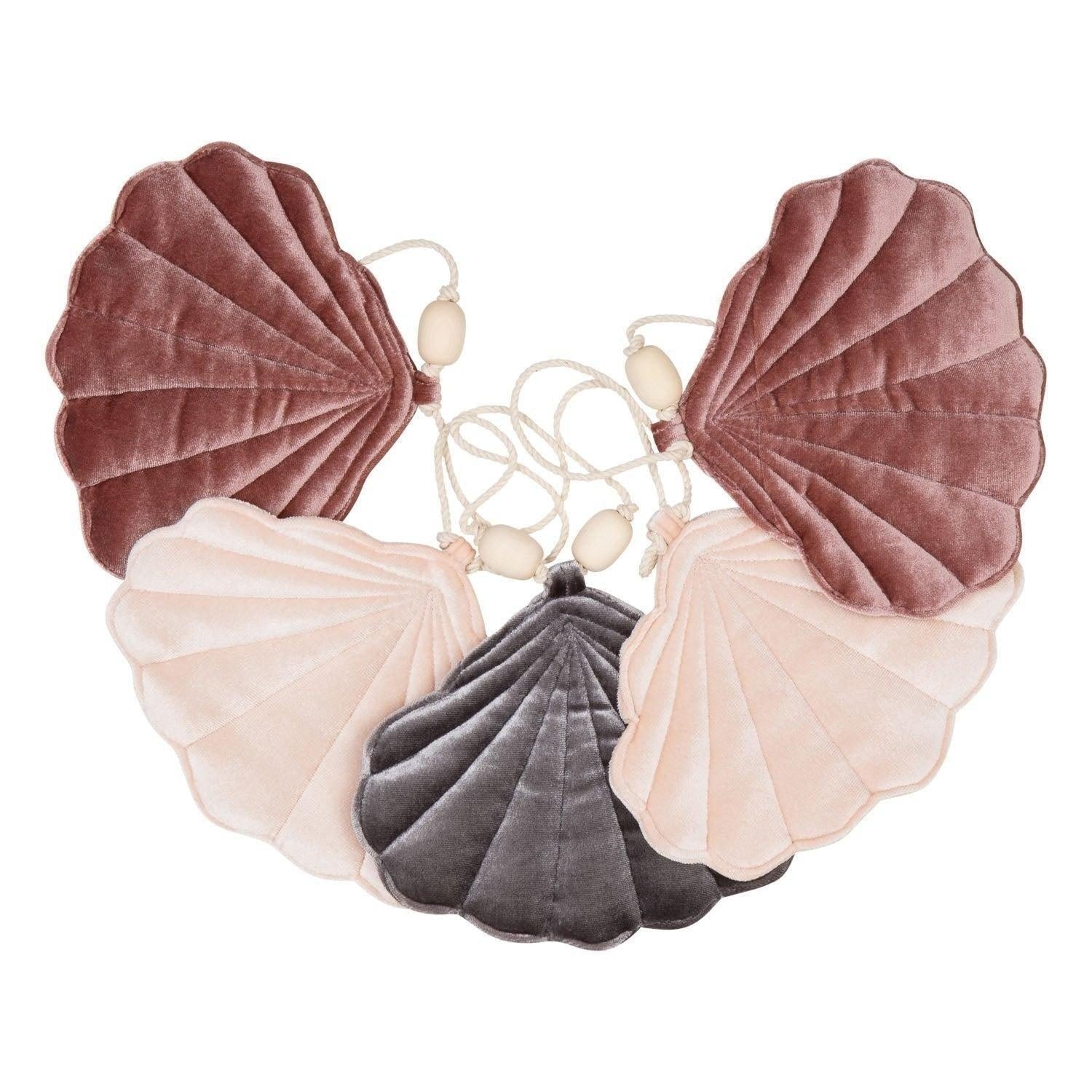 elegant cosmic pearl shell garland with velvet shells and wooden beads, draped gracefully for refined decor