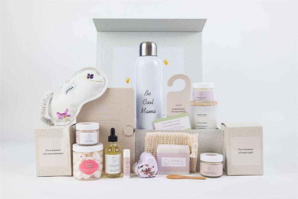 bold presentation of a complete organic gift set for moms with lavender spa products and a journal