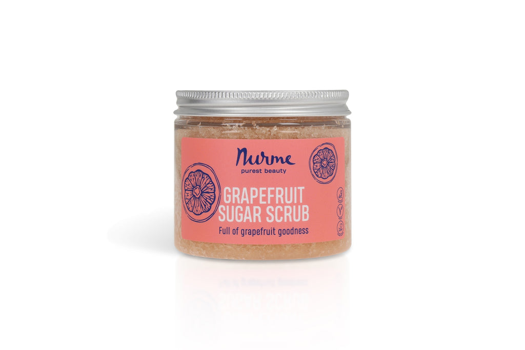 bold close-up of vibrant grapefruit sugar scrub with visible pink clay and sugar crystals
