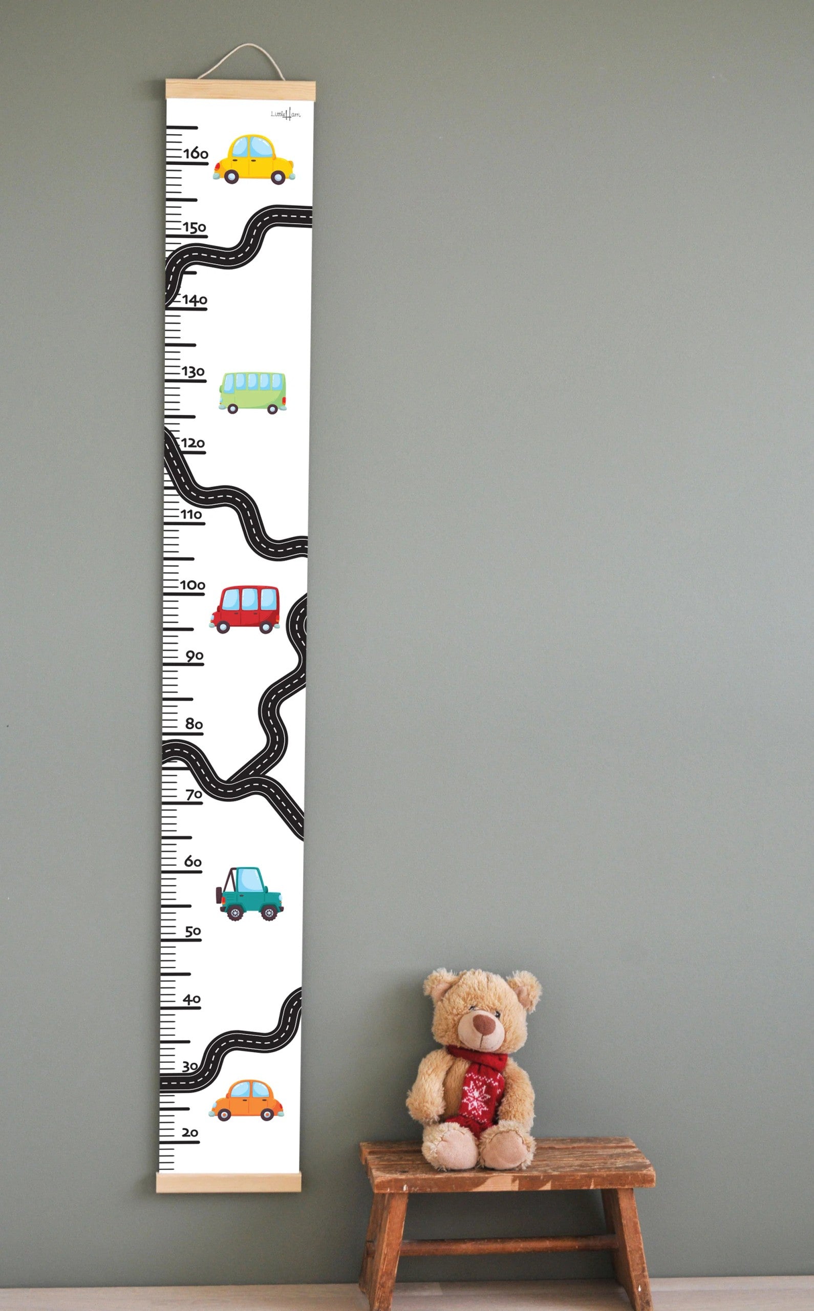 confident close-up of a vibrant cars growth chart on a child's wall