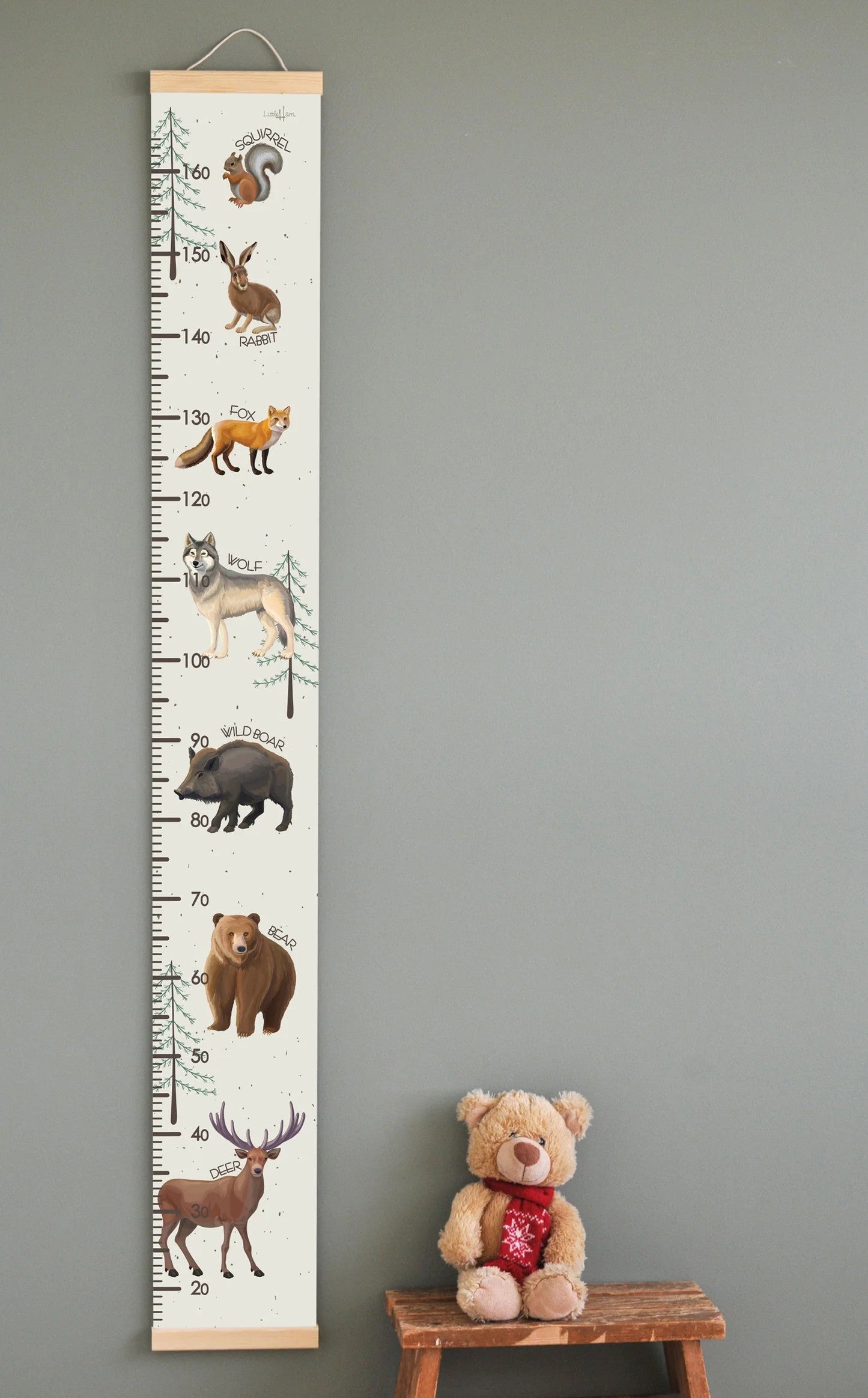 confident full-length shot of the wild animals growth chart standing tall against a clean wall